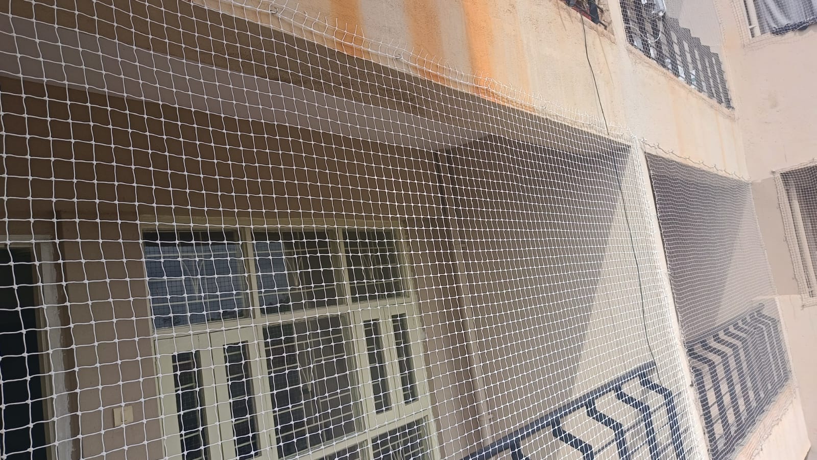 A secure balcony with safety nets installed