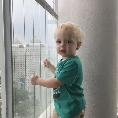 Children playing safely on a balcony with nets